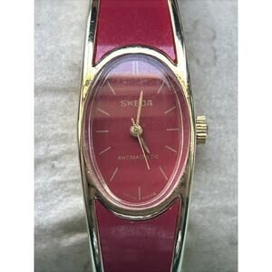 Sweda Antimagnetic Gold And Red Tone Women’s Wind Watch